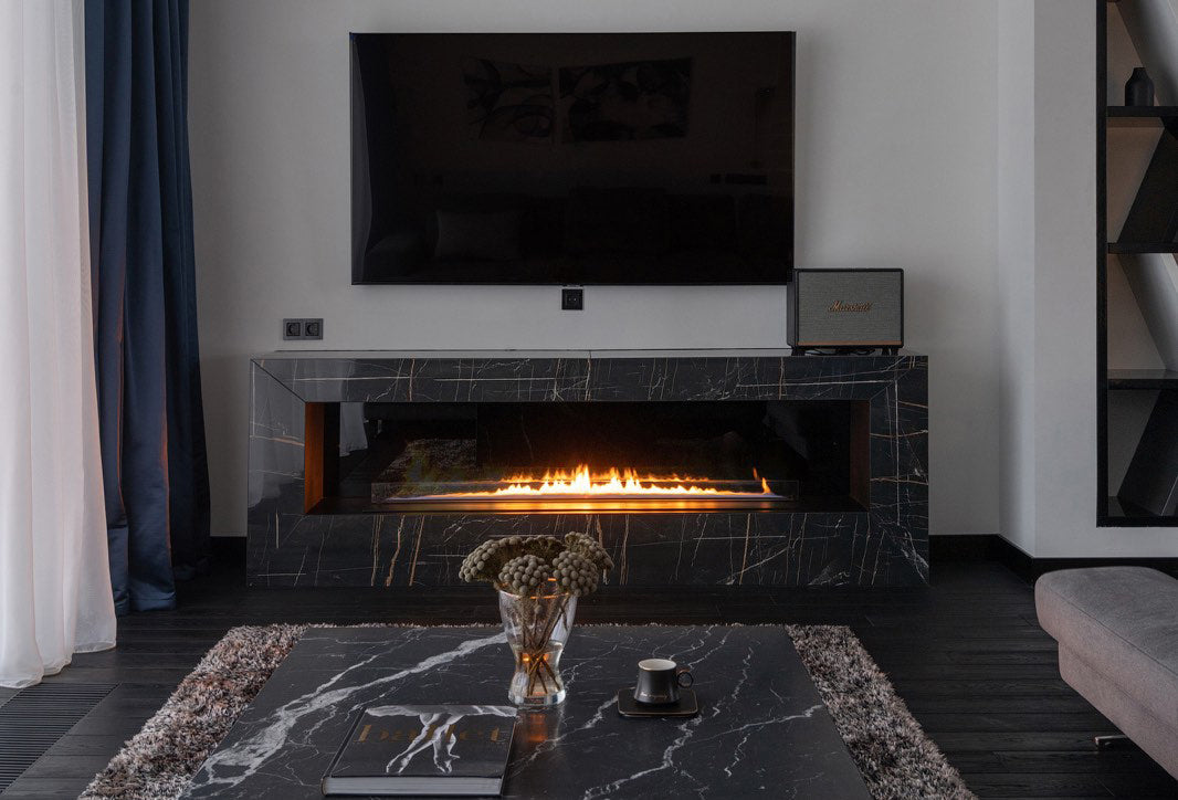 Built-in automatic bioethanol fireplace with clean frameless design and remote control ignition.