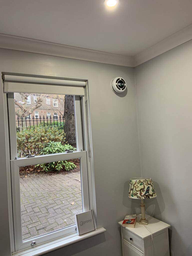 Heat recovery ventilation system installation in a bright room, showcasing efficiency for fresh air and mold prevention.