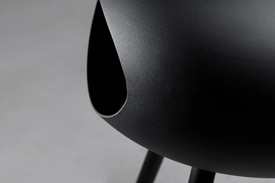 Close-up of the sleek black finish on the Le Feu Dome Bioethanol Fireplace base.