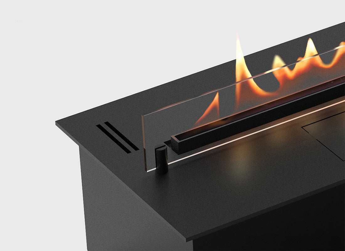Close-up of DALEX 1500 automatic bioethanol fireplace with flame and sleek black design.
