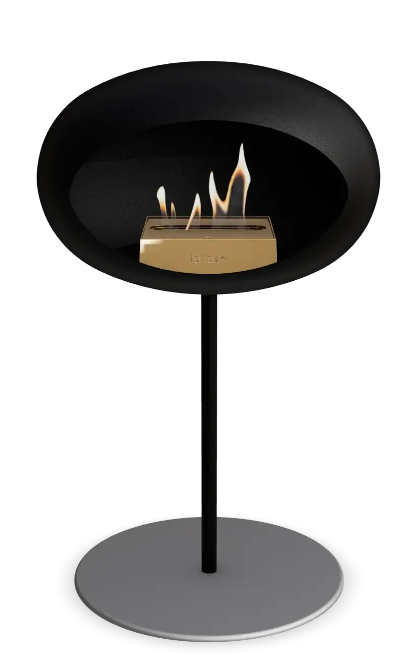 Freestanding Le Feu Dome bioethanol fireplace with stylish black design and visible flames.