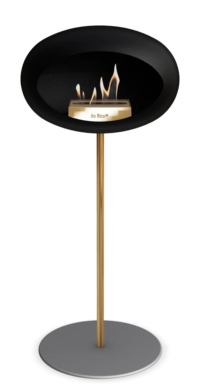 Freestanding black bioethanol fireplace by Le Feu Dome, stylish and eco-friendly for indoor and outdoor spaces.