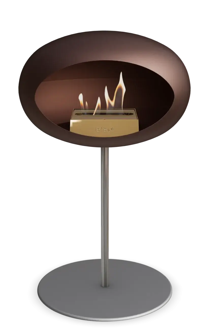 Freestanding Le Feu Dome low bioethanol fireplace in mocca color, modern design for indoor and outdoor spaces.