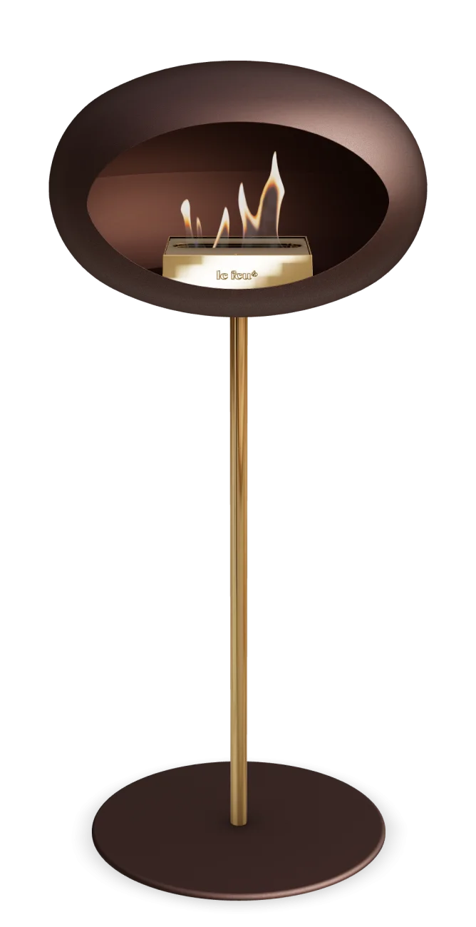 Freestanding bioethanol fireplace Le Feu Dome in mocca color with elegant gold stand, perfect for modern interiors.