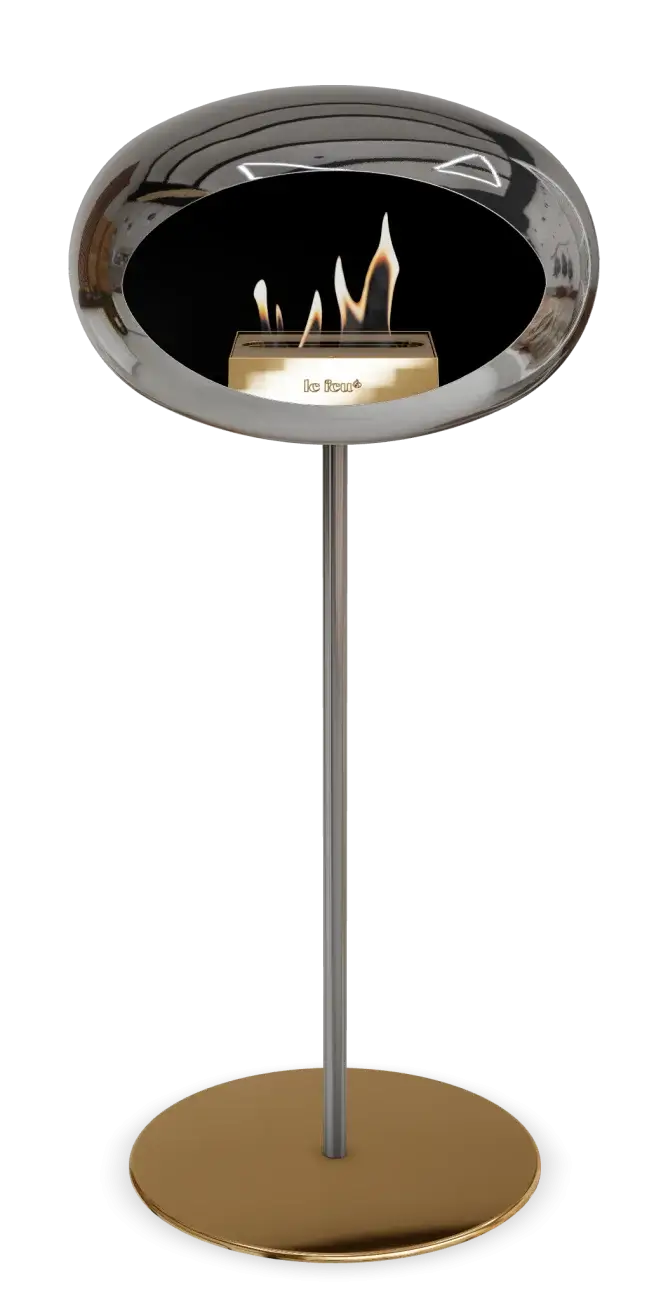 Freestanding bioethanol fireplace Le Feu Dome in chromed silver, combining elegance and modern design for cozy warmth.