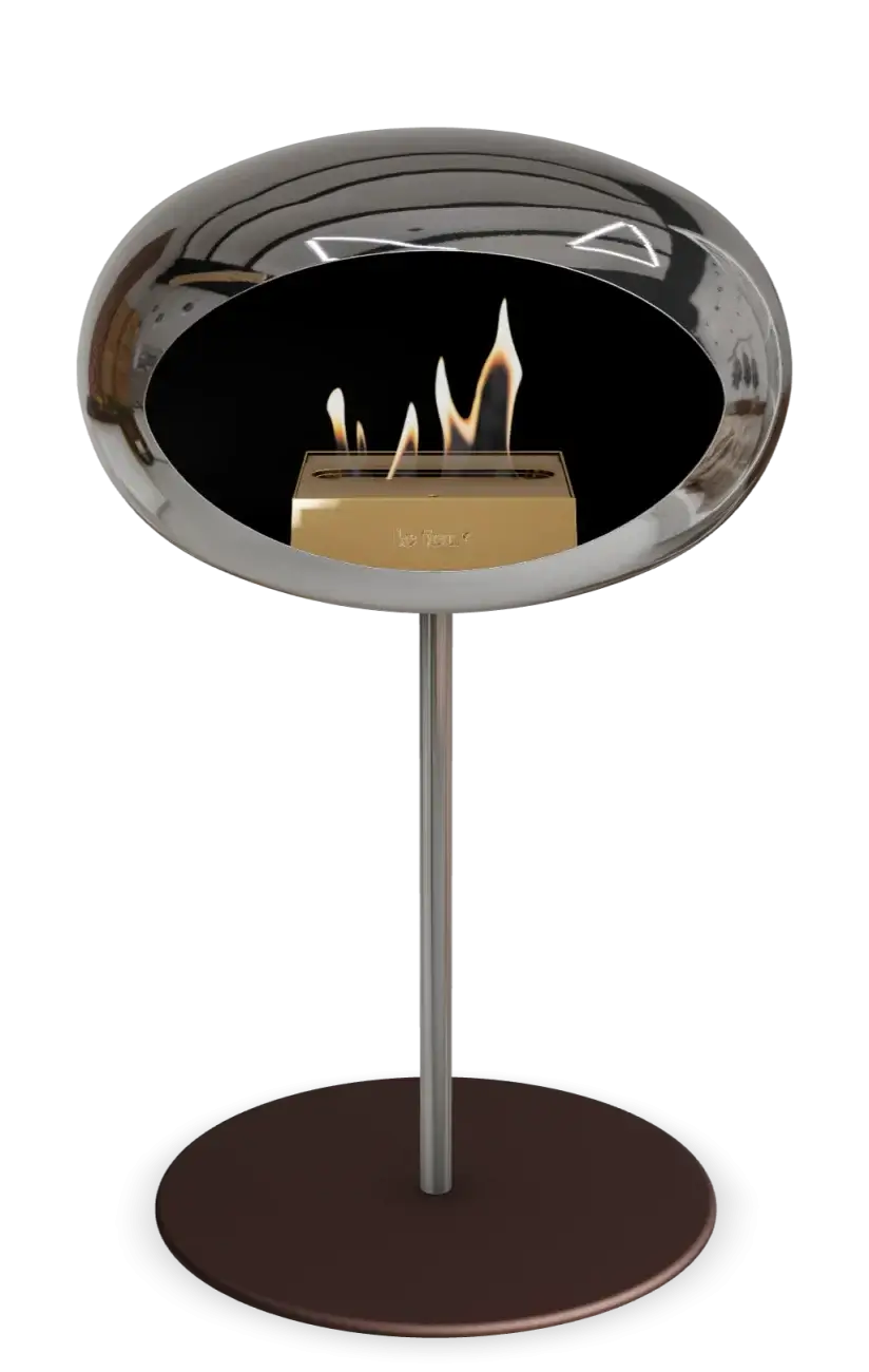 Freestanding chromed silver bioethanol fireplace Le Feu Dome, modern design with elegant flame display.