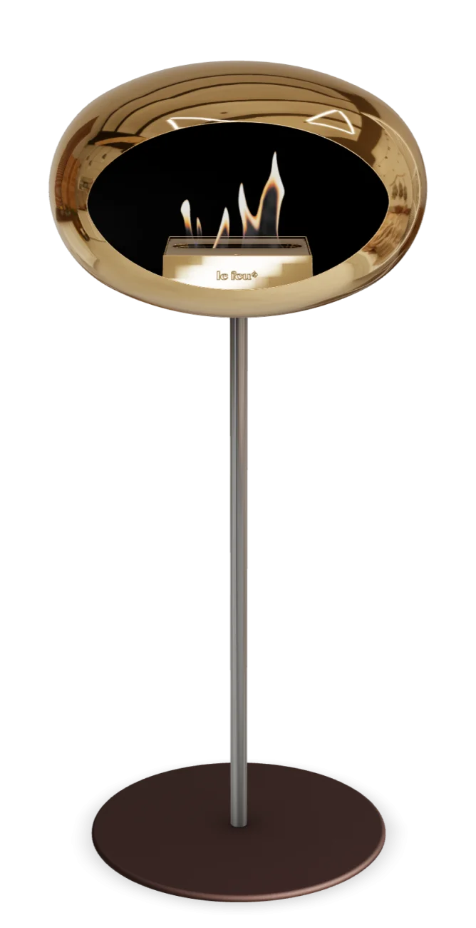 Freestanding bioethanol fireplace in chromed rose gold with modern design and cozy flames.