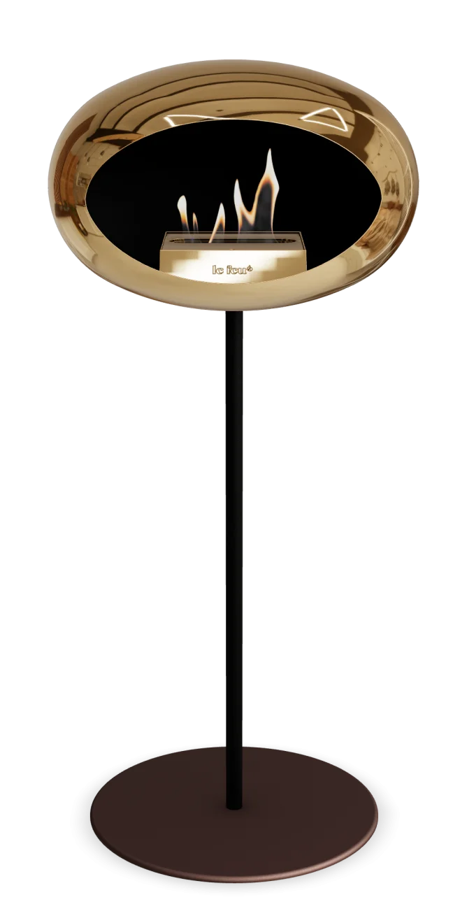 Freestanding bioethanol fireplace Le Feu Dome in chromed rose gold and black, offering modern design and warmth.