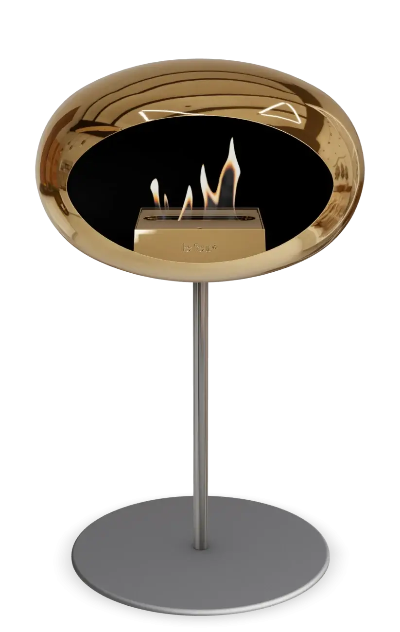 Stylish freestanding bioethanol fireplace in chromed rose gold for indoor and outdoor spaces.