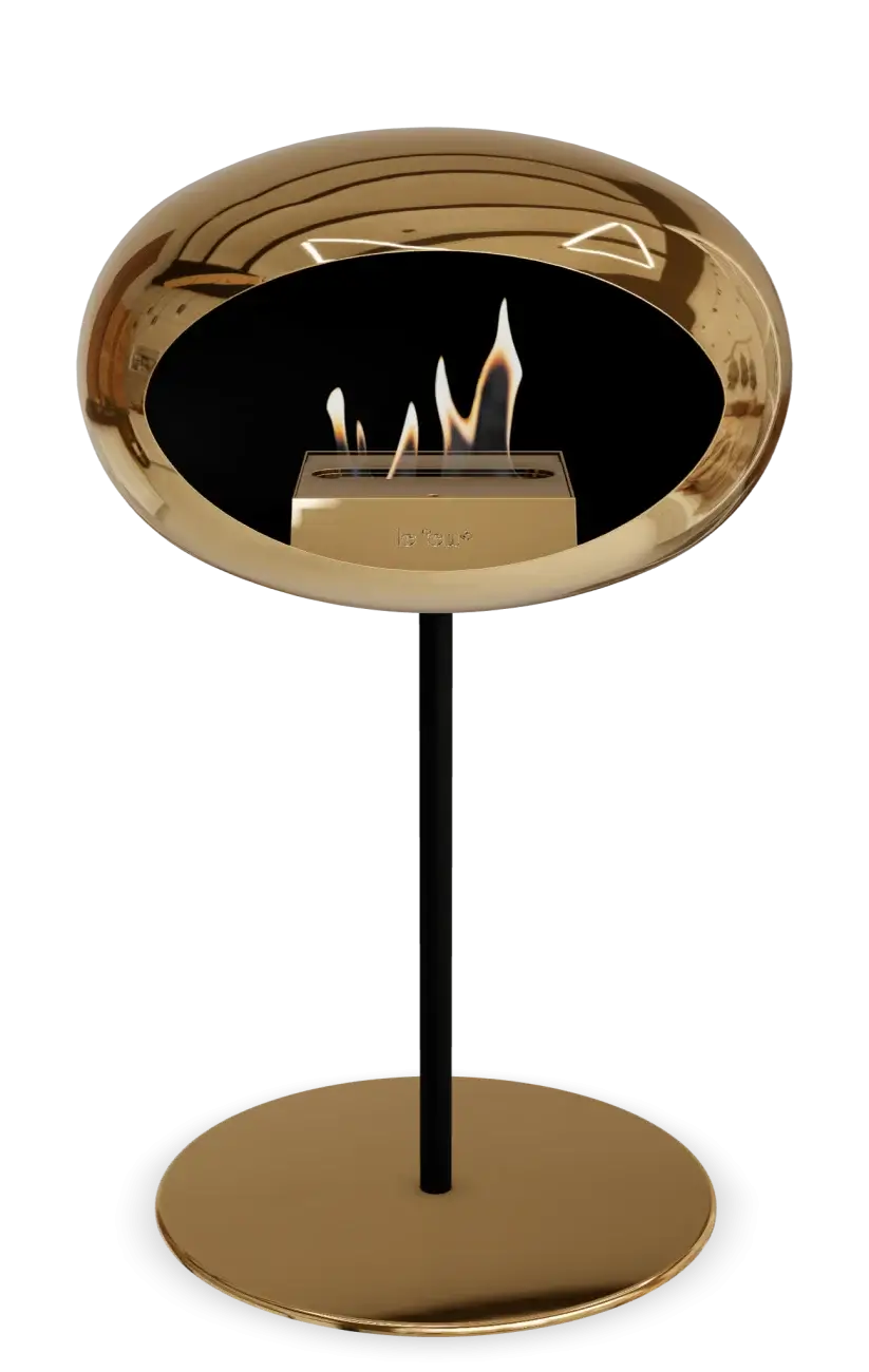Freestanding bioethanol fireplace in chromed rose gold, featuring modern design and stylish flames.