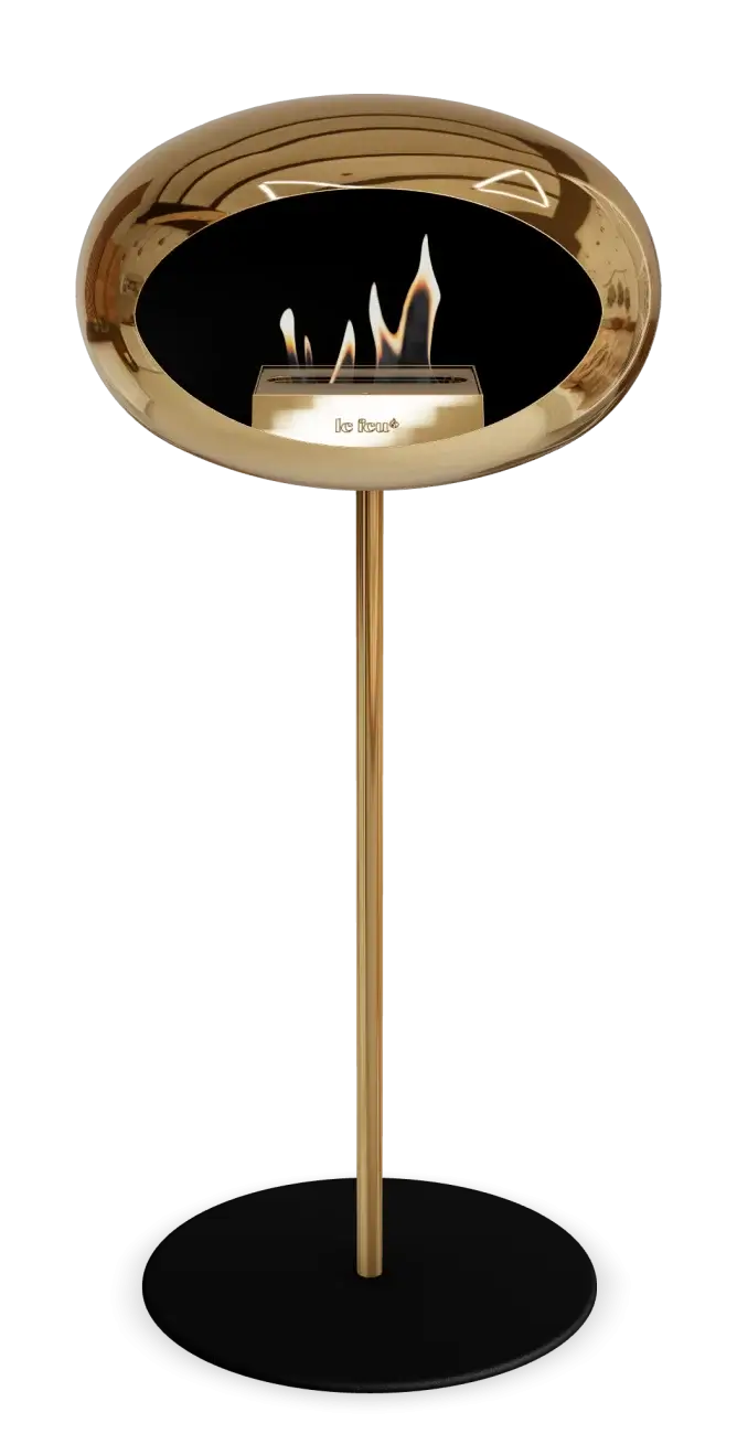 Freestanding bioethanol fireplace with chromed rose gold finish and modern design, providing warmth and elegance.