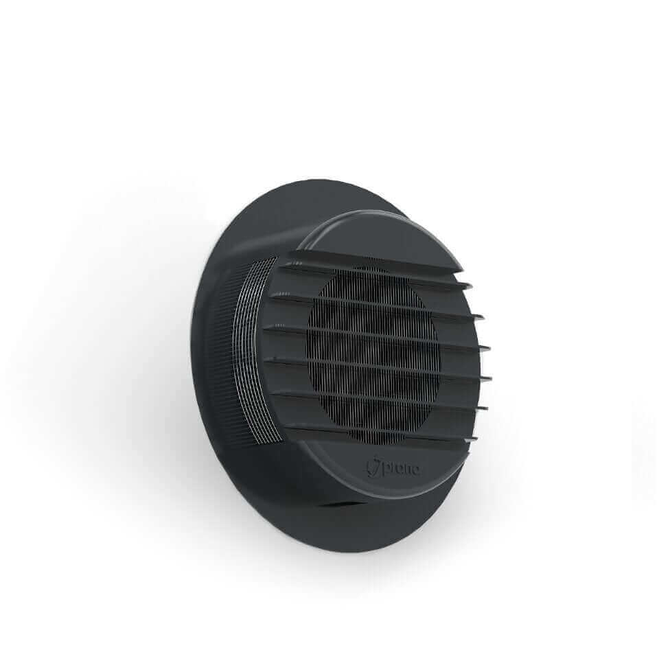 PRANA black plastic decorative ring installed on brick wall, enhancing ventilation system aesthetics.