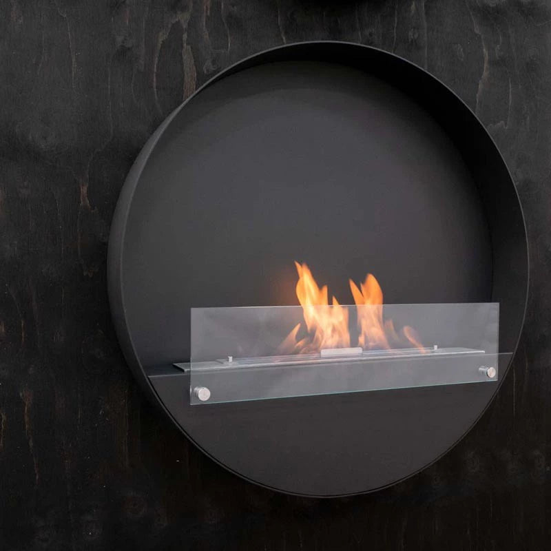 Delaware XL round black bio fireplace with glass flame barrier, designed for eco-friendly home decor.
