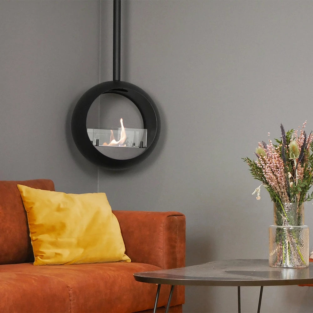Edmonton 2-sided suspended bioethanol fireplace with flames, stylish living room setting, and decorative vase.