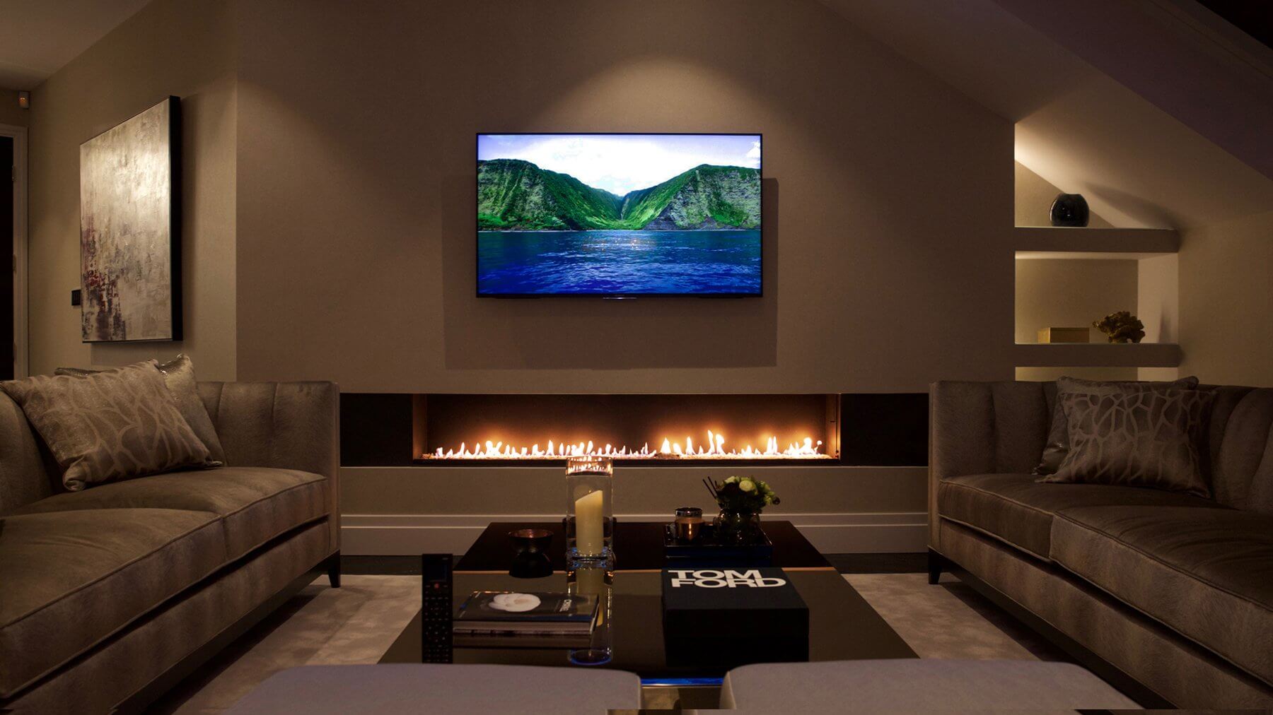 Modern living room featuring a built-in bioethanol fireplace and wall-mounted TV, creating a cozy atmosphere.