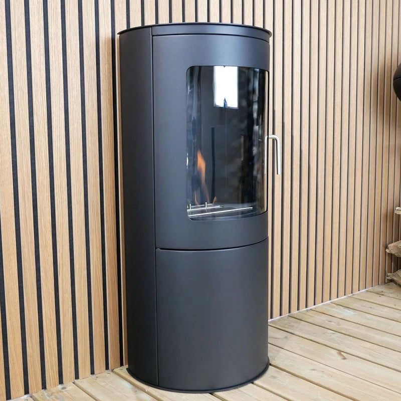 Richmond bioethanol fireplace stove with flat back, freestanding design, placed against a wooden wall.