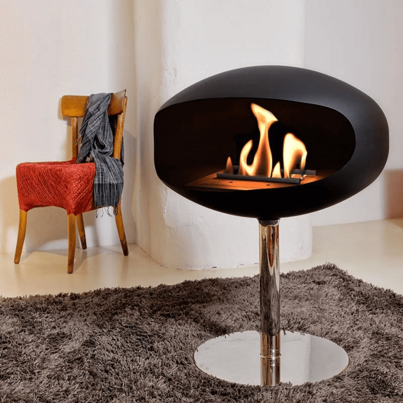 Cocoon Pedestal bioethanol fireplace in matte black, elegant design with steel pedestal, ideal for modern interiors.