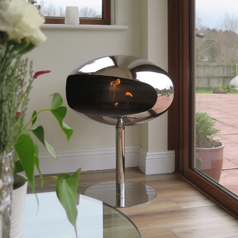 Cocoon Pedestal bioethanol fireplace in polished steel, showcasing modern design and elegance in a stylish living space.