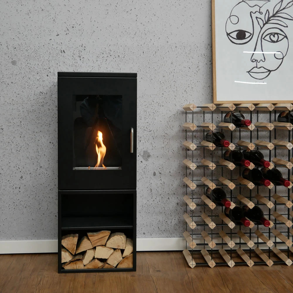 Cheyenne bioethanol fireplace with glass sides and wood storage, modern freestanding design for indoor ambiance.