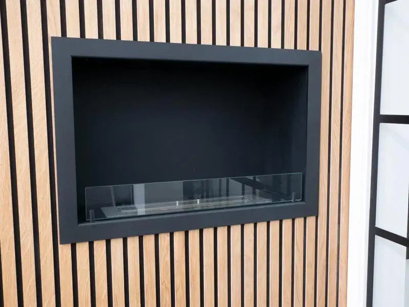 Stylish built-in bioethanol fireplace Foco One 800, featuring a sleek black frame and tempered glass, designed for modern interiors.