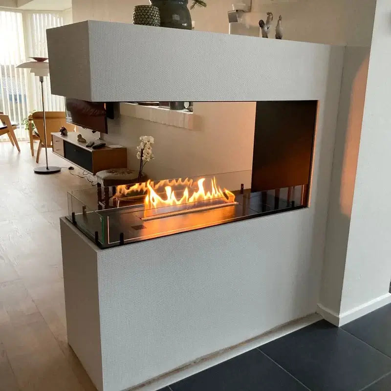 Modern bioethanol fireplace room divider showcasing three-sided view and flame ambience in contemporary living space.
