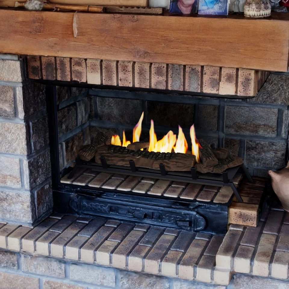 Freestanding bioethanol fire grate XL with flames in a traditional fireplace setting.
