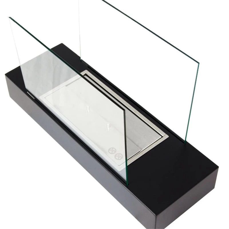Freestanding black bioethanol fireplace with two glass panels, designed for table or floor use, showcasing beautiful flames.