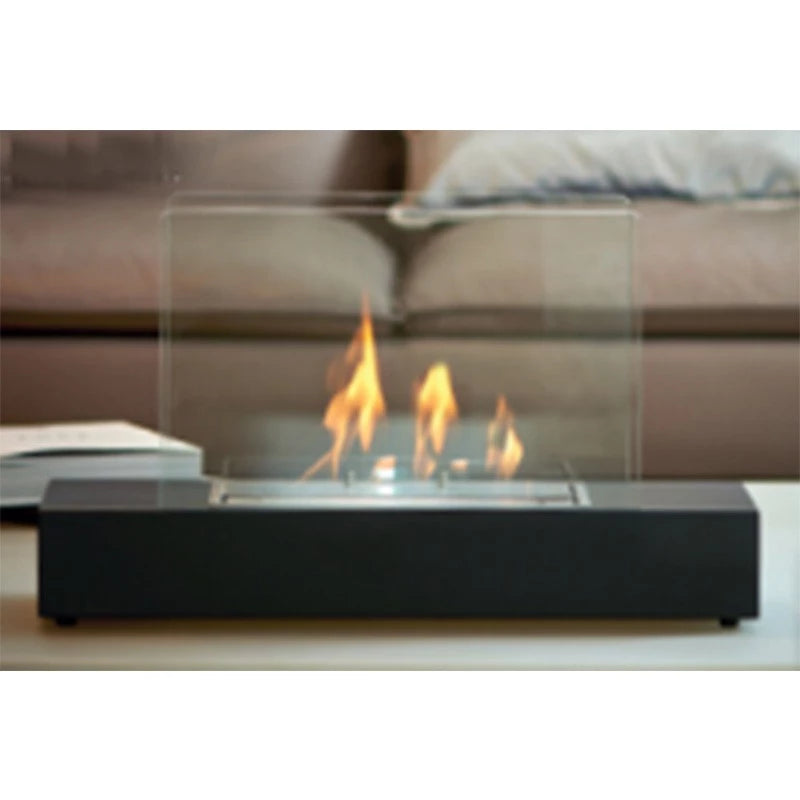 Black freestanding bioethanol fireplace with glass panels, offering a clear view of the flames.