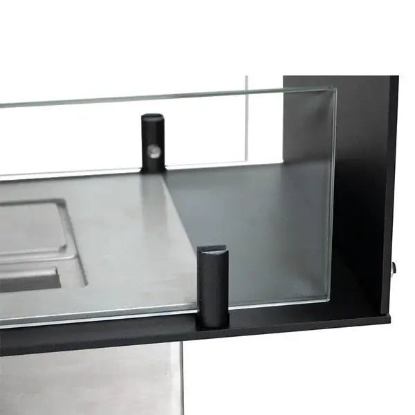Close-up view of the glass and frame components of a modern bioethanol fireplace insert.