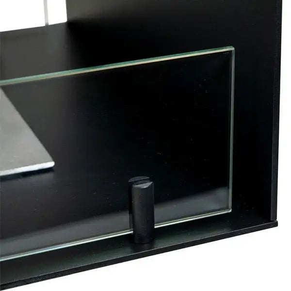Close-up of tempered glass panel and black powder-coated base of the Fireplace Foco Room Divider 800 bioethanol fireplace.