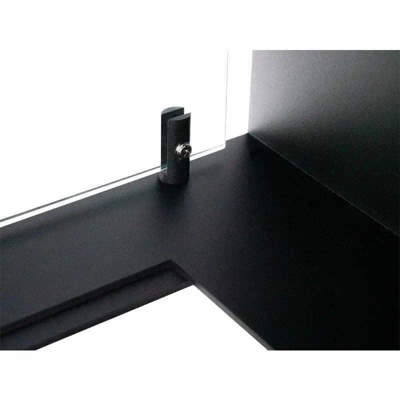 Detail of black metal frame with glass installation feature for a bioethanol fireplace.