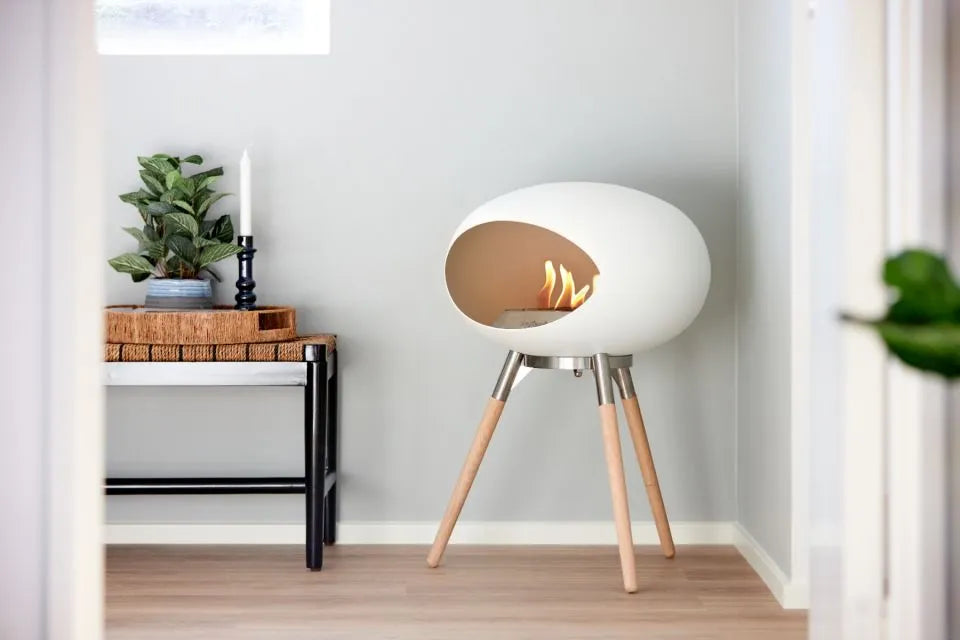 Stylish Le Feu Dome Ground Low bioethanol fireplace in white, featuring modern design and eco-friendly warmth.