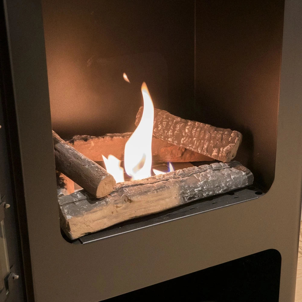 Ceramic logs burning in a bio fireplace, showcasing their realistic wood-like appearance and flames.