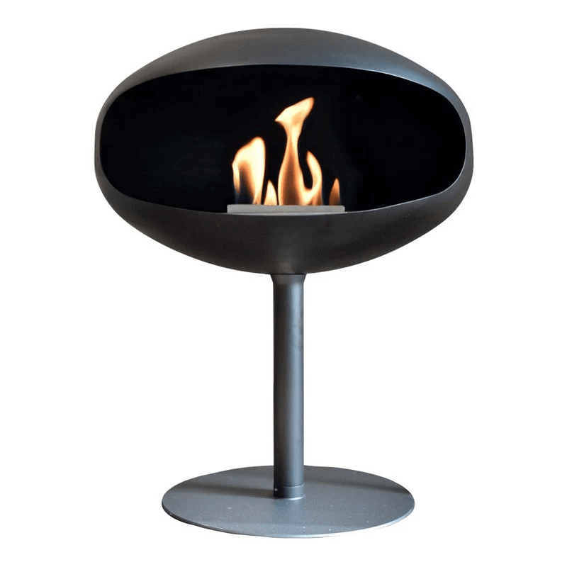 Cocoon Pedestal black bioethanol fireplace with modern design and flame, freestanding carbon steel construction.