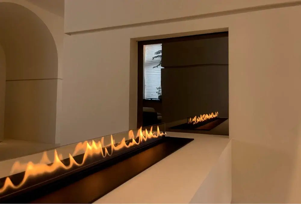Modern automatic bioethanol fireplace DALEX Touch showcasing vibrant flames in a sleek minimalist design.