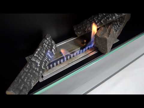 Close-up of Nebraska Black wall mounted bioethanol fireplace with flames and decorative stones.