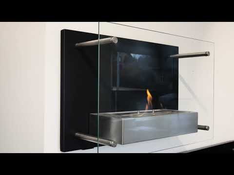 Nevada wall mounted bioethanol fireplace with glass shield, showcasing flames and modern stainless steel burner.
