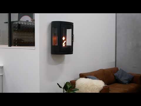 Oregon wall-mounted bioethanol stove displaying flames through glass, enhancing home decor and ambiance.