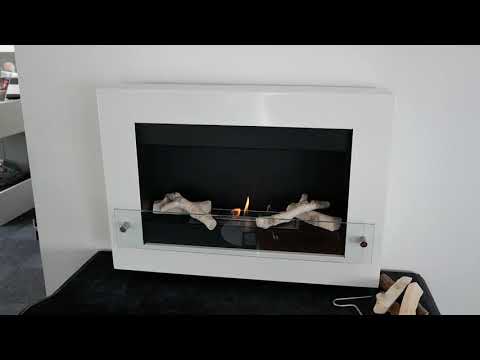Nebraska Black wall mounted bioethanol fireplace showcasing flames and decorative logs in a sleek design.