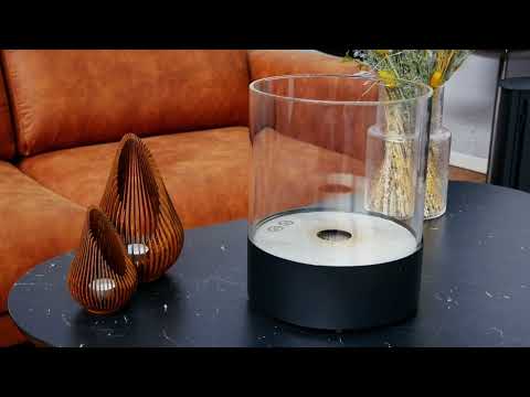 Southwark black round tabletop bioethanol fireplace with clear glass and modern design, featured on a stylish living room table.