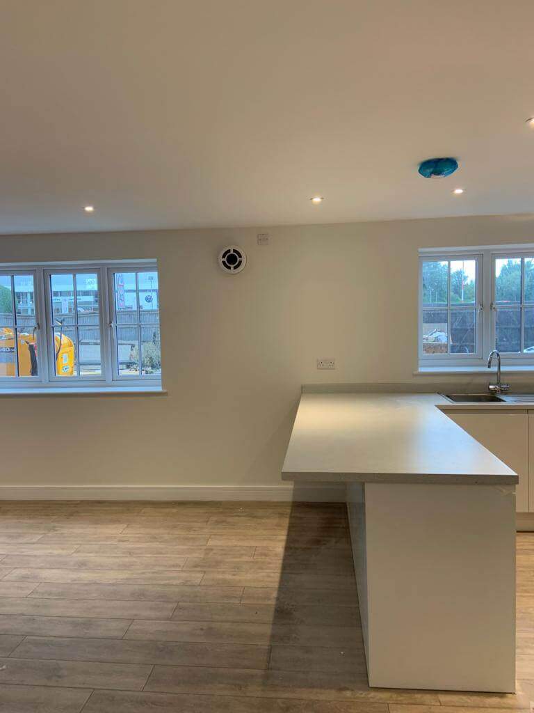 Modern kitchen with an MVHR system for heat recovery ventilation and fresh air supply.