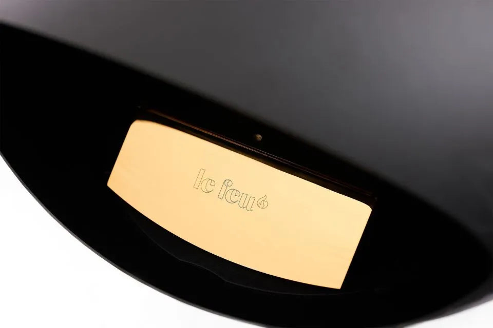 Close-up of Le Feu bioethanol fireplace branding on the black dome design.