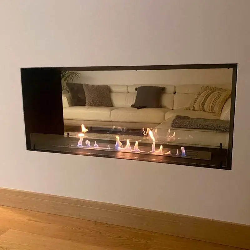 Modern bioethanol fireplace insert showcasing flames and elegant interior design in a cozy living room.