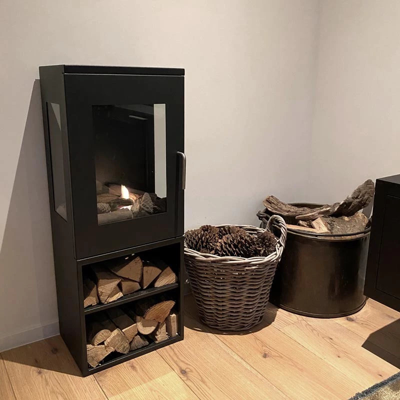 Cheyenne bioethanol fireplace, freestanding design with glass sides, showcasing flame and wood storage.