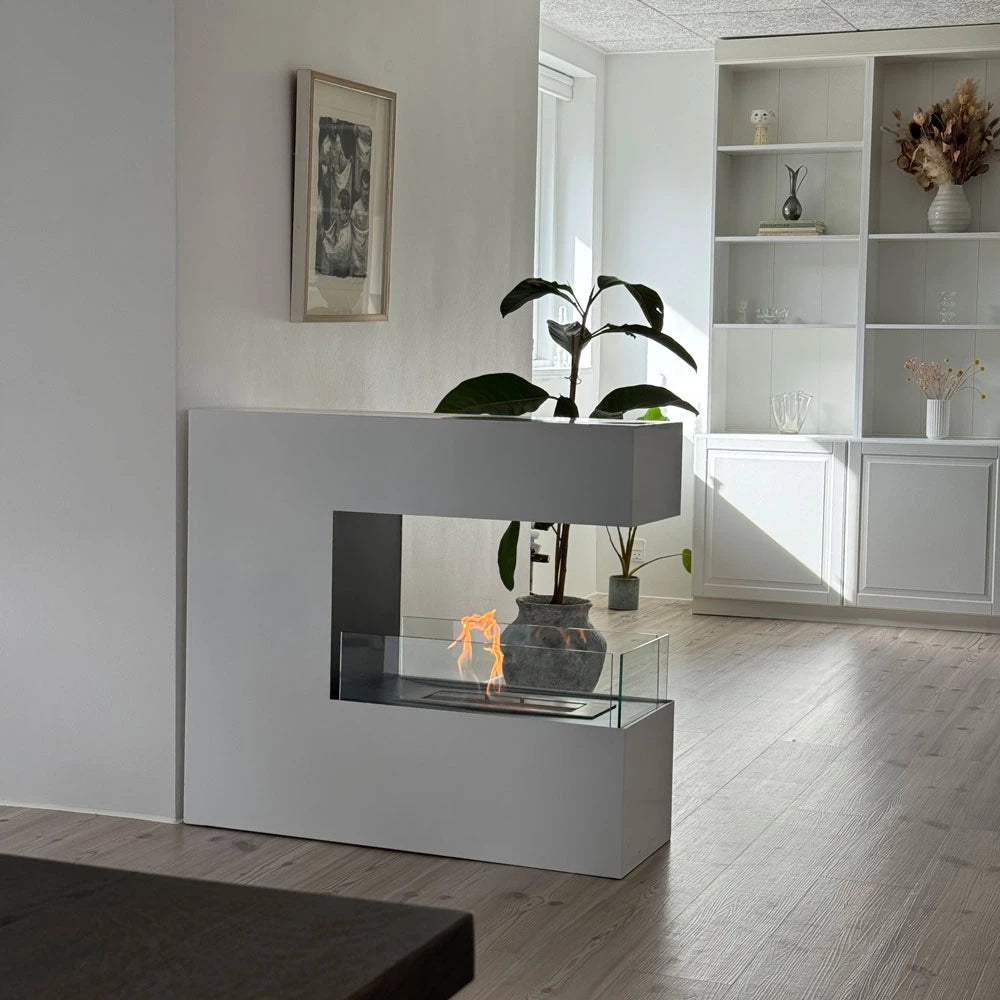 Contemporary Topeka White freestanding bioethanol fireplace showcasing flames through glass tiles in a stylish living room.