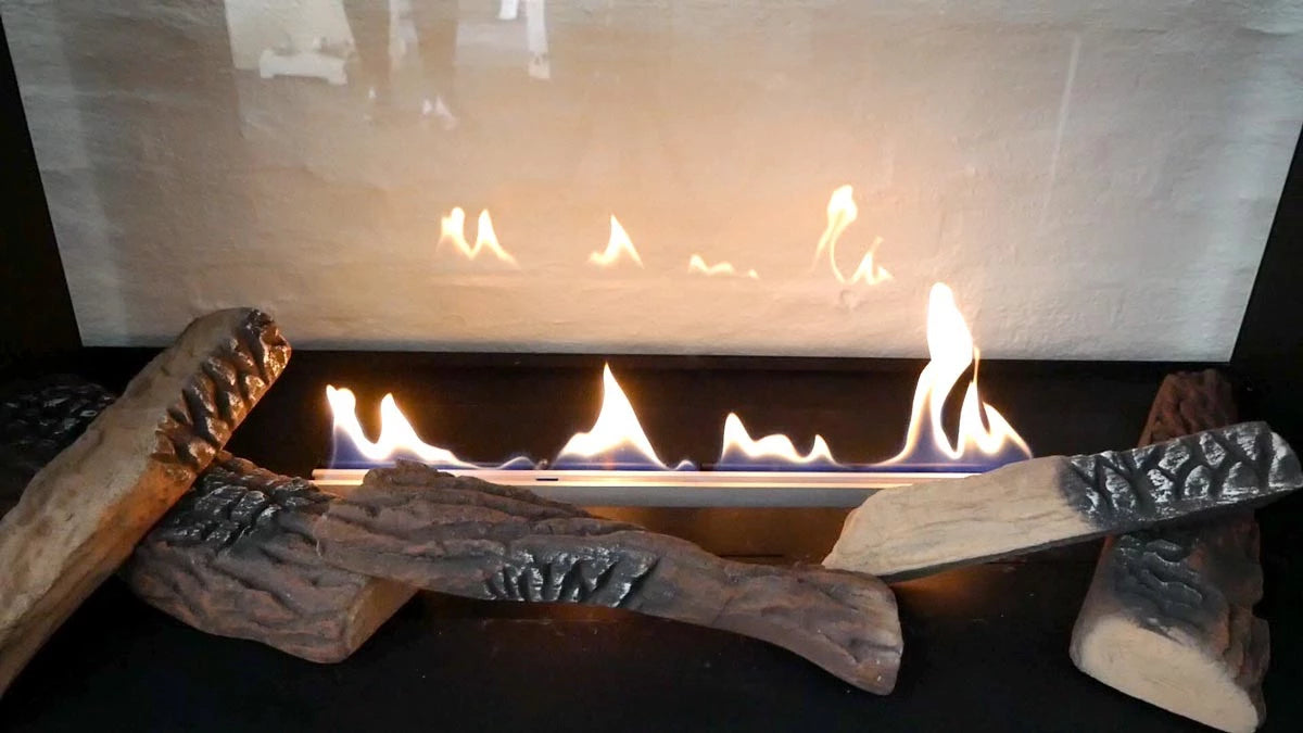 Ceramic wood pieces for bio fireplace with flames, creating a natural look for modern decor.
