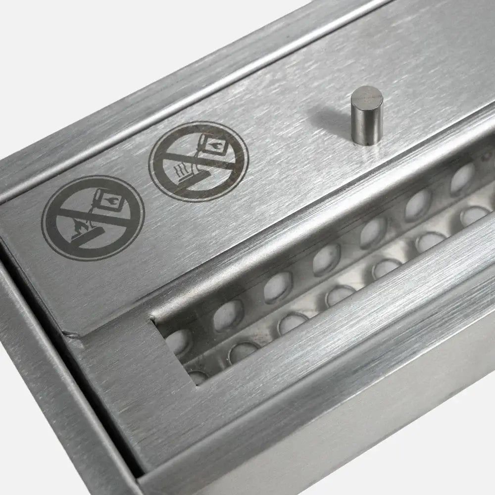 Close-up of the stainless steel manual bioethanol burner showing safety icons and fuel chamber.