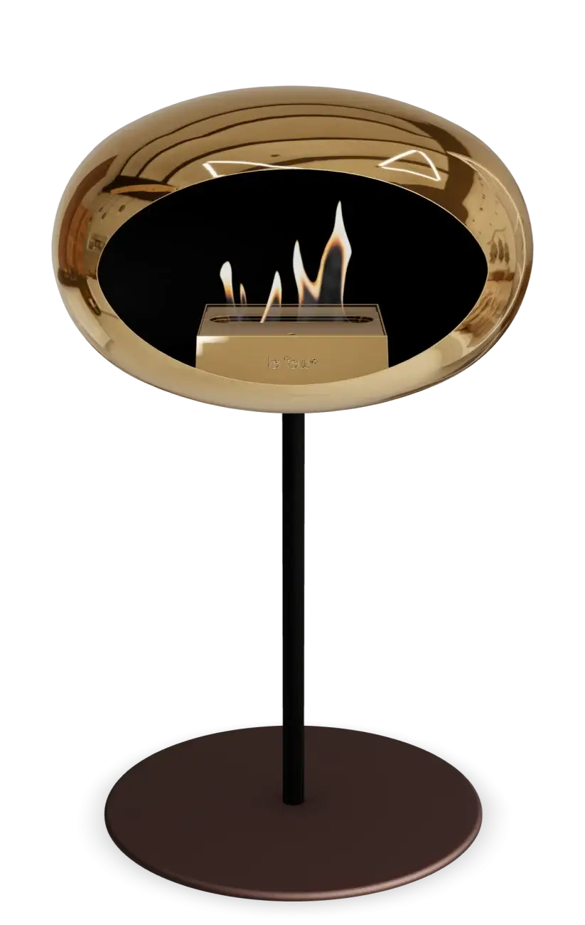Freestanding bioethanol fireplace Le Feu Dome in chromed rose gold, stylish and eco-friendly for indoor or outdoor use.