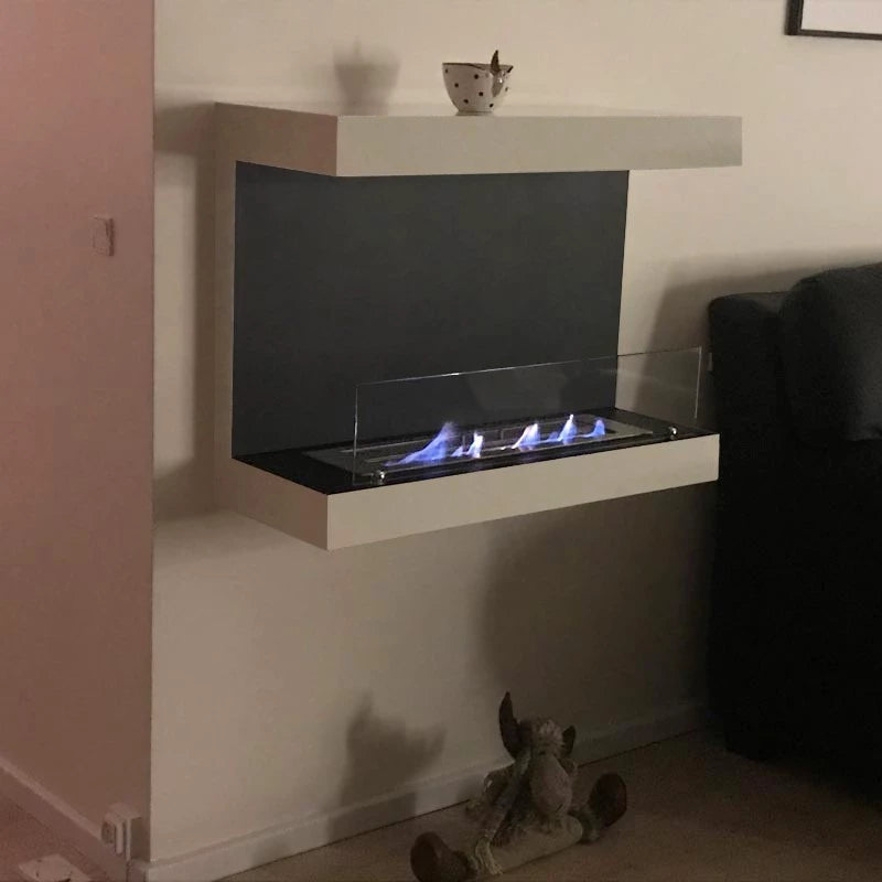 Dakota White three-sided 80 cm wall-mounted bioethanol fireplace with flames and modern design.