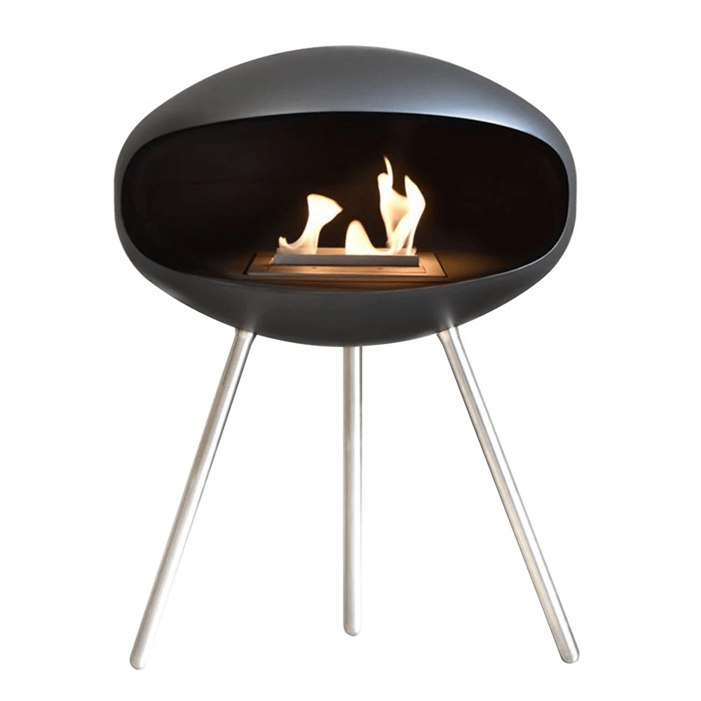 Cocoon Terra Matte Black bioethanol fireplace with steel legs and flame, modern design accent for any room.